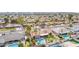 Aerial view of backyard with pool, mini golf, lush landscaping and desert flora at 502 E Le Marche Ave, Phoenix, AZ 85022