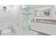 Elegant bathroom with a glass-enclosed shower, modern fixtures, and a spacious vanity at 502 E Le Marche Ave, Phoenix, AZ 85022