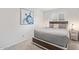 Cozy bedroom with a platform bed, gray bedding, and stylish nightstands with lamps at 502 E Le Marche Ave, Phoenix, AZ 85022