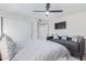 This bedroom offers a daybed, television, large sliding door closet, and neutral finishes at 502 E Le Marche Ave, Phoenix, AZ 85022