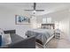 Comfortable bedroom featuring neutral tones, ceiling fan, mini split, and stylish furnishings at 502 E Le Marche Ave, Phoenix, AZ 85022