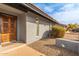 Exterior shot of the property entrance with a beautifully carved front door and desert-themed landscaping at 502 E Le Marche Ave, Phoenix, AZ 85022