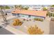 Aerial shot of single-Gathering home with desert landscaping and neutral-colored exterior and concrete driveway at 502 E Le Marche Ave, Phoenix, AZ 85022