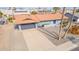 Aerial view of the home featuring a two-car garage, concrete driveway, and desert landscaping at 502 E Le Marche Ave, Phoenix, AZ 85022