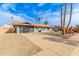 Single-Gathering home with gray exterior, concrete driveway, desert landscaping, and an attached garage at 502 E Le Marche Ave, Phoenix, AZ 85022