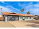 Charming home with a two-car garage, driveway, gray exterior, orange roof, and landscaped front yard at 502 E Le Marche Ave, Phoenix, AZ 85022