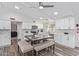 Bright, updated kitchen featuring white cabinets, backsplash, and dining table with bench seating at 502 E Le Marche Ave, Phoenix, AZ 85022