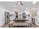 Modern kitchen with white cabinetry, stainless steel appliances, and large center island with seating at 502 E Le Marche Ave, Phoenix, AZ 85022