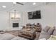 Bright living room featuring a fireplace, entertainment center and comfortable seating area at 502 E Le Marche Ave, Phoenix, AZ 85022