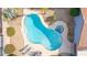 Aerial view of a kidney-shaped pool with a built-in spa and lounge chairs at 502 E Le Marche Ave, Phoenix, AZ 85022