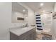 Basement bathroom with walk-in shower and modern vanity at 521 E Lehi Rd, Mesa, AZ 85203