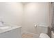 Clean bathroom with a white vanity, toilet, and shower/tub combo at 521 E Lehi Rd, Mesa, AZ 85203