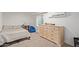 Small bedroom with twin bed and large dresser at 521 E Lehi Rd, Mesa, AZ 85203