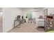Small bedroom with twin bed, desk, and built-in shelving at 521 E Lehi Rd, Mesa, AZ 85203