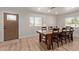 Bright dining area with rustic wood table and chairs at 521 E Lehi Rd, Mesa, AZ 85203