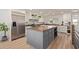 Modern kitchen with large island and stainless steel appliances at 521 E Lehi Rd, Mesa, AZ 85203