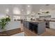 Open concept kitchen with an island and breakfast bar, perfect for entertaining at 521 E Lehi Rd, Mesa, AZ 85203