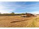 Open land with a shed and trailer, offering ample space at 521 E Lehi Rd, Mesa, AZ 85203