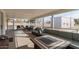 Screened patio features comfortable seating and fire pit at 521 E Lehi Rd, Mesa, AZ 85203