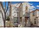 Two-story home with neutral stucco, reddish trim, an archway, and a balcony at 5374 W Chisum Trl, Phoenix, AZ 85083