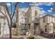 Two-story home with neutral stucco, reddish trim, an archway, and a balcony at 5374 W Chisum Trl, Phoenix, AZ 85083