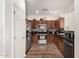 Updated kitchen features stainless steel appliances, granite countertops, and ample cabinet space at 5374 W Chisum Trl, Phoenix, AZ 85083