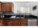 Modern kitchen features stainless steel appliances, dark countertops, and ample cabinet space at 5374 W Chisum Trl, Phoenix, AZ 85083