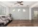 Inviting living room with beautiful hardwood floors, plenty of natural light, and a comfortable couch at 5374 W Chisum Trl, Phoenix, AZ 85083