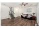 Open-concept living space with hardwood floors and access to the staircase at 5374 W Chisum Trl, Phoenix, AZ 85083