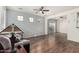 Spacious living room featuring hardwood floors, ample natural light, and a ceiling fan at 5374 W Chisum Trl, Phoenix, AZ 85083