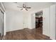 Open floor plan living room showcasing hardwood flooring and easy access to the kitchen at 5374 W Chisum Trl, Phoenix, AZ 85083