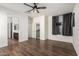 Large primary bedroom with hardwood floors, a ceiling fan, and a walk-in closet at 5374 W Chisum Trl, Phoenix, AZ 85083