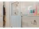 Clean bathroom with a walk-in shower and tiled walls at 8700 E University Dr # 1315, Mesa, AZ 85207