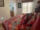 Bright bedroom with southwest-themed decor leading into a bathroom at 8700 E University Dr # 1315, Mesa, AZ 85207