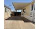 Spacious carport area providing covered parking and access to an outdoor patio area at 8700 E University Dr # 1315, Mesa, AZ 85207