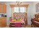Small dining area with wooden table and chairs near kitchen at 8700 E University Dr # 1315, Mesa, AZ 85207