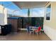 Relaxing covered patio with a garden shed, patio set, and privacy screen, perfect for outdoor living and entertaining at 8700 E University Dr # 1315, Mesa, AZ 85207
