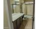 Well-lit bathroom with a large vanity, shower, and tile flooring at 9441 E Juanita Ave, Mesa, AZ 85209