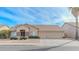 Charming single-story home featuring a three car garage and a xeriscaped front yard for low maintenance at 9441 E Juanita Ave, Mesa, AZ 85209