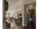 Open concept kitchen and dining area with granite countertops and hardwood floors at 9441 E Juanita Ave, Mesa, AZ 85209