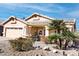 Single-story home with a two-car garage and desert landscaping at 968 W Breckenridge Ave, Gilbert, AZ 85233