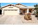 House exterior with two-car garage and landscaped yard at 968 W Breckenridge Ave, Gilbert, AZ 85233