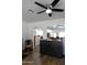 Open-concept living area featuring wood floors, white walls, and seamless flow to other rooms at 968 W Breckenridge Ave, Gilbert, AZ 85233