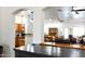 Open-concept living space with kitchen, dining, and living areas with hardwood floors at 968 W Breckenridge Ave, Gilbert, AZ 85233