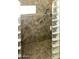 Close up of luxurious tile shower with stone tile floor and glass block wall at 968 W Breckenridge Ave, Gilbert, AZ 85233