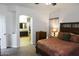 Main bedroom with carpet floors leading to a bathroom and walk-in closet at 968 W Breckenridge Ave, Gilbert, AZ 85233