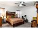 Spacious bedroom featuring ceiling fan, carpet floors, a bed, and exercise bike at 968 W Breckenridge Ave, Gilbert, AZ 85233
