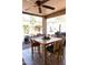 Covered patio features a large wooden dining table with seating for eight at 968 W Breckenridge Ave, Gilbert, AZ 85233
