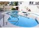 Relax by the refreshing pool with a convenient handrail at 968 W Breckenridge Ave, Gilbert, AZ 85233