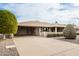 Front view of the house showcasing the driveway and landscaping at 10210 W Charter Oak Dr, Sun City, AZ 85351